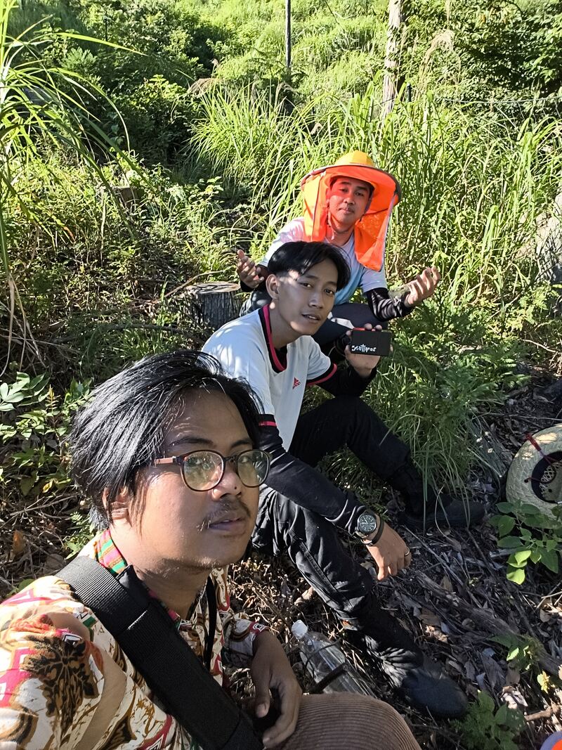 Two crew members in safety gear ready for work